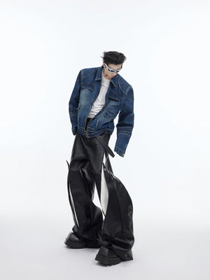 Male model wearing oversized black deconstructed leather wide-leg pants