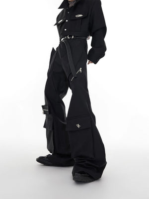 Front view of black deconstructed flare streetwear pants with metal pockets