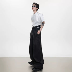 Minimalist black wide-leg pants styled for a casual streetwear look