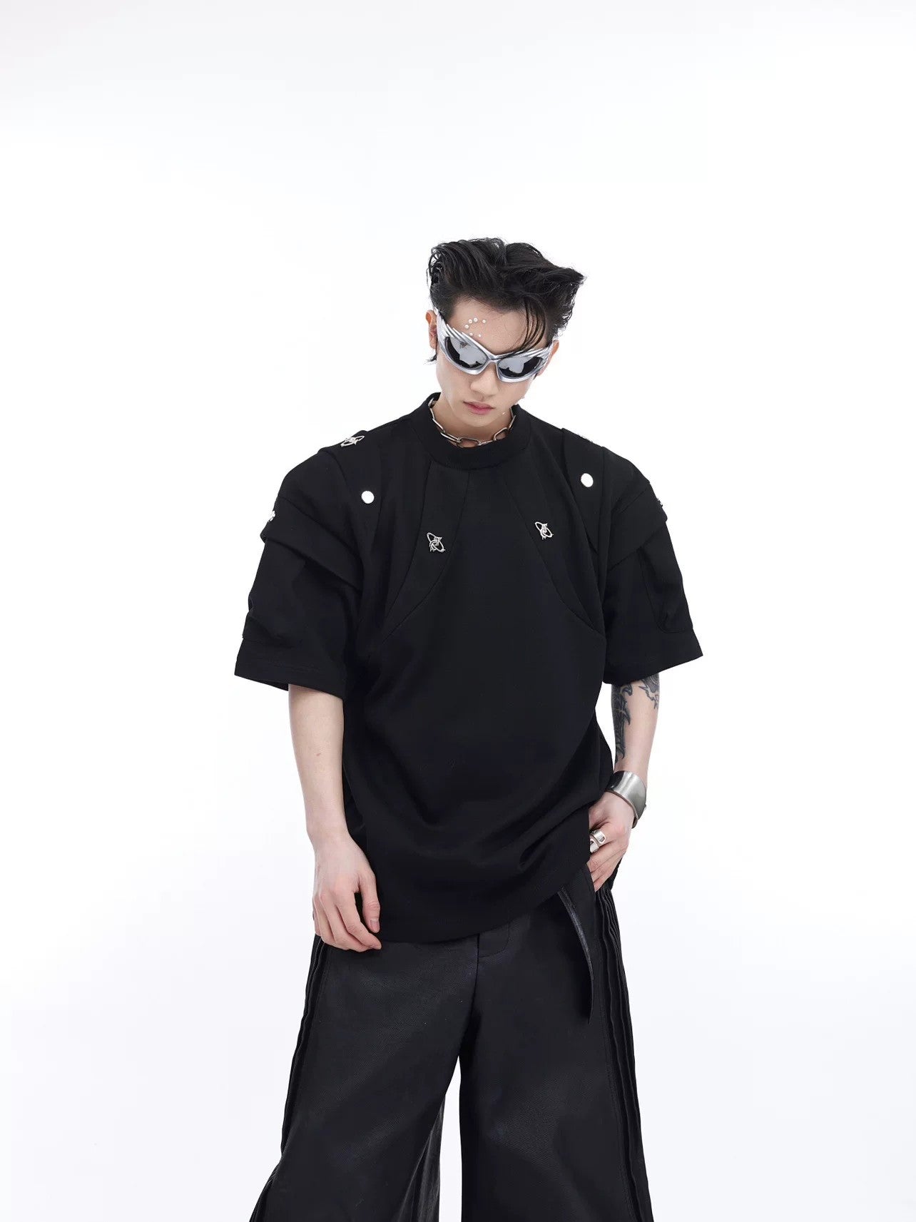 Front view of deconstructed black streetwear t-shirt with padded shoulders