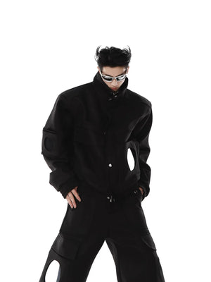 Model wearing the mirror patchwork jacket in an urban streetwear setting.