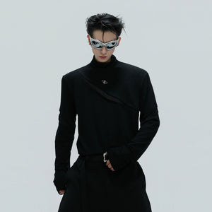 Close-up of silver metal logo on black cotton base layer