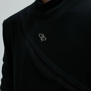 Detailed view of deconstructed stitching and cut-out design