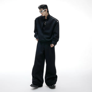 Front view of black deconstructed mock neck sweatshirt and baggy pants set