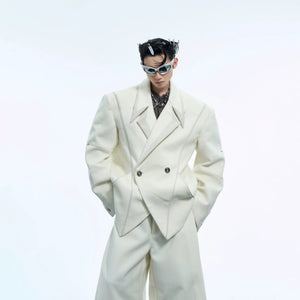 Back view of loose-fit white blazer showing deconstructed tailoring