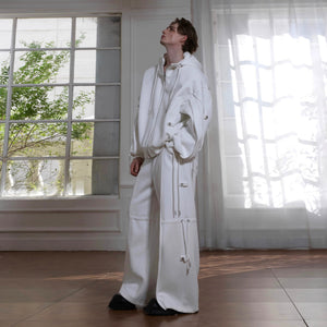 White oversized hoodie showing unique deconstructed sleeve construction