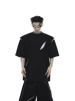 Unisex model wearing black oversized deconstructed T-shirt in urban setting
