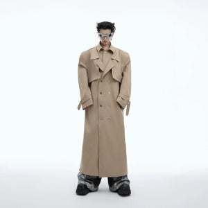 Front view of an oversized deconstructed 2-in-1 streetwear trench coat in black.