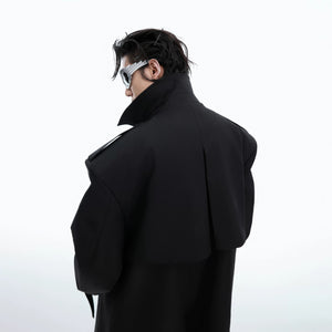 Model wearing the yellow oversized deconstructed trench coat in a city setting.