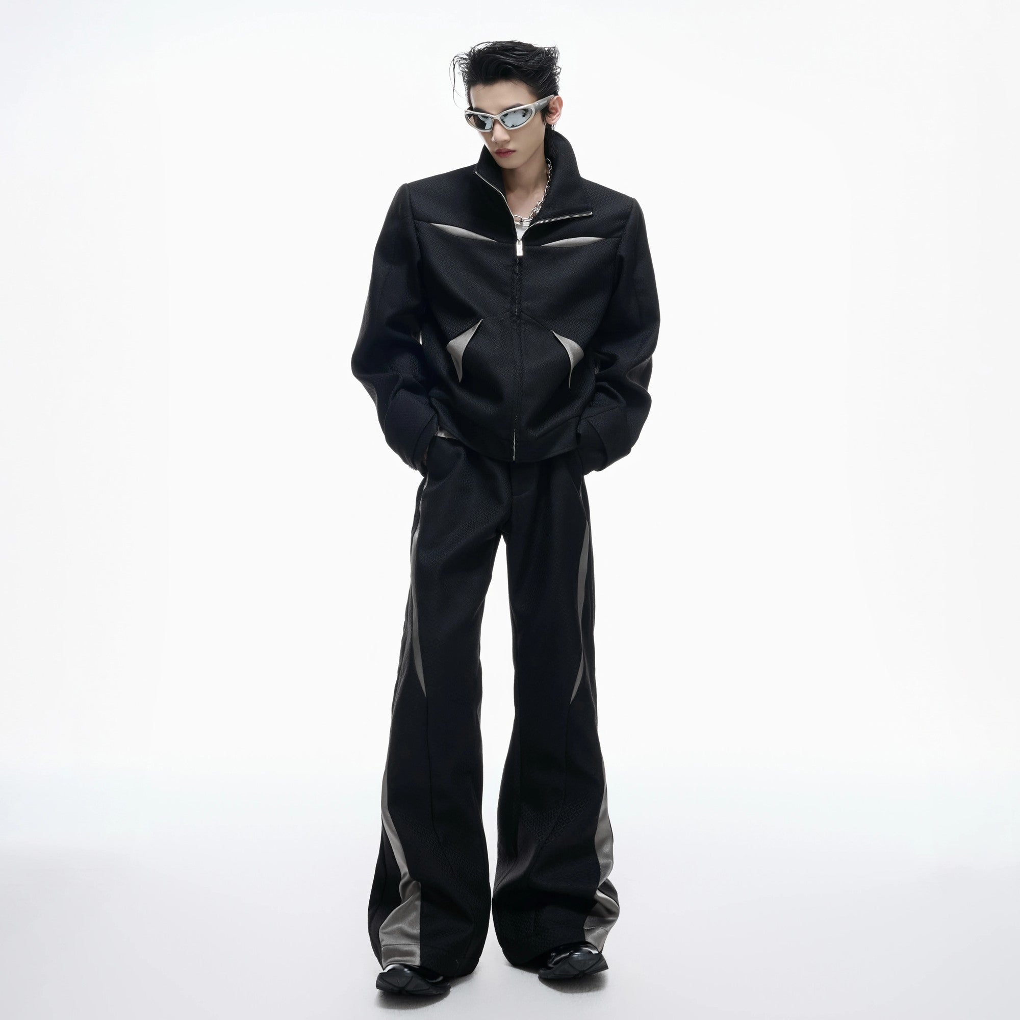 Back profile of the unisex patchwork streetwear set in black