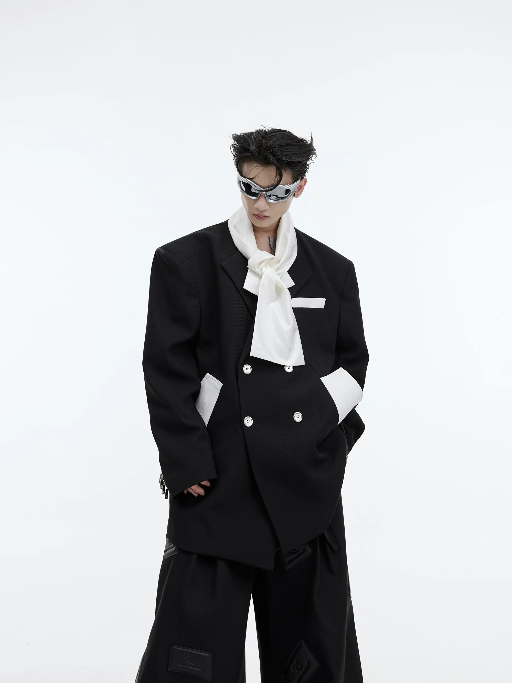Front view of men's deconstructed oversized blazer with tie patchwork design
