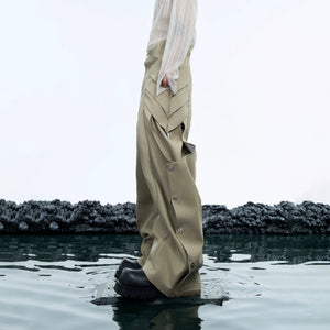 Front view of deconstructed pleated cargo pants in street style setting