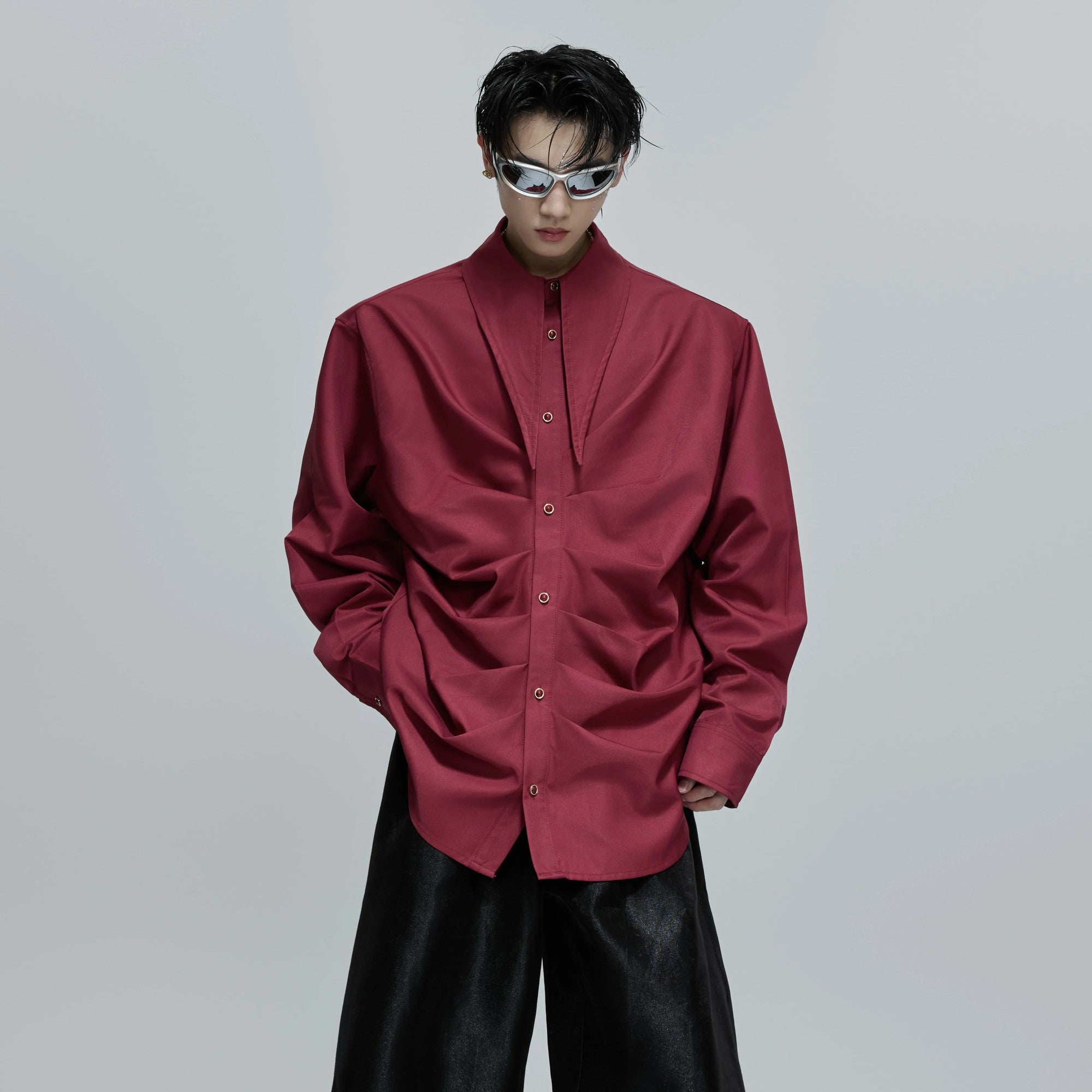 Close up of the intricate pleated texture and shell bead buttons