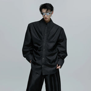 Model wearing black deconstructed shirt in a city walk setting