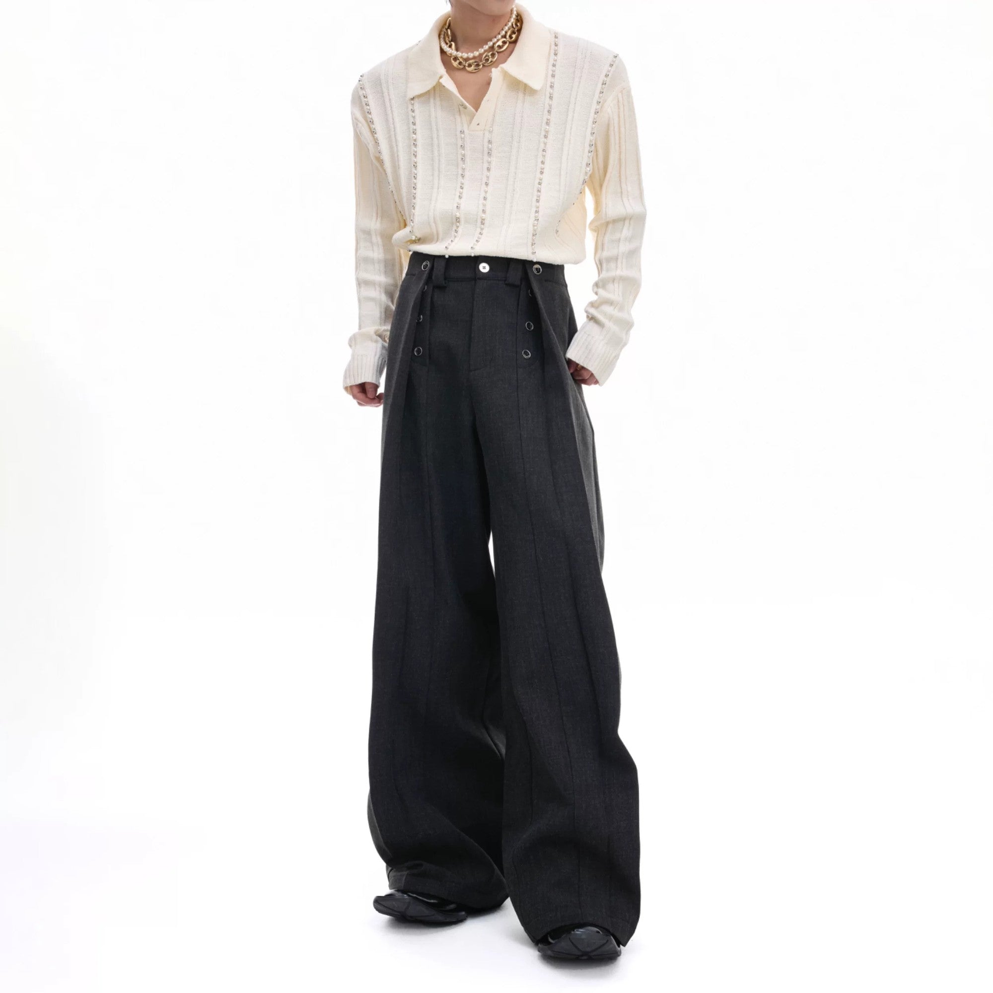 Front view of men's deconstructed pleated straight-leg trousers in black