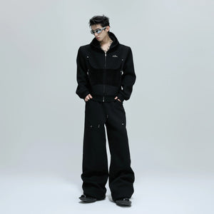 Model wearing the gray deconstructed cropped hoodie in a street setting