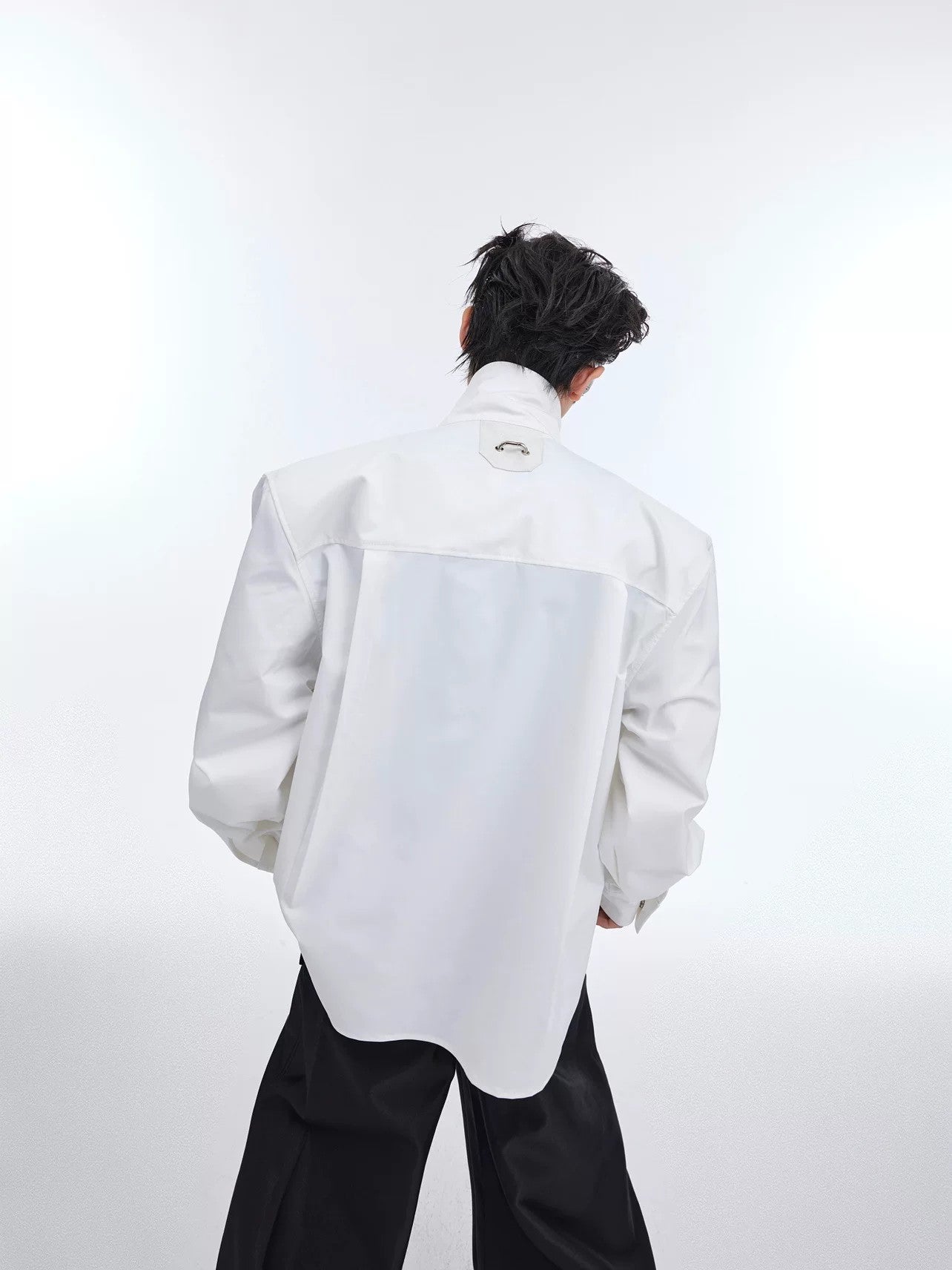 Back view of loose fit deconstructed streetwear shirt