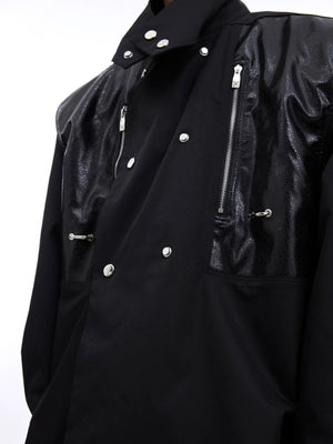 White deconstructed leather shirt styled with wide-leg pants