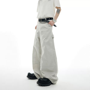 Back view showing the boxy fit of the deconstructed short sleeve jacket