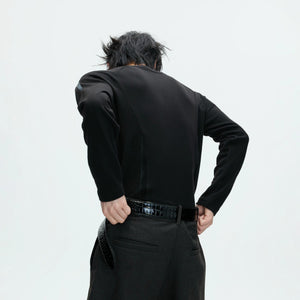 Male model wearing slim fit deconstructed streetwear thermal top