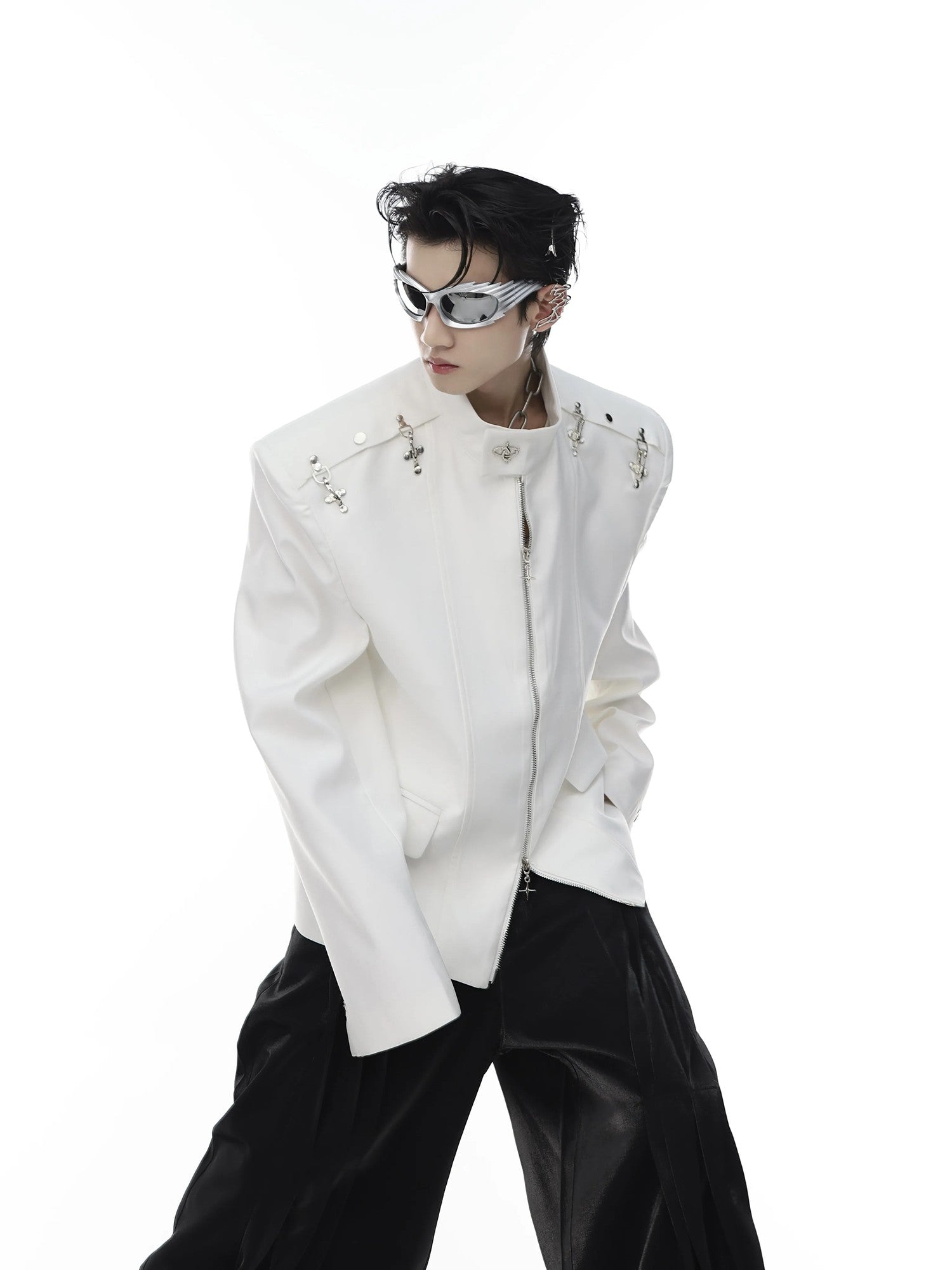 Front view of black deconstructed streetwear jacket with metal airplane buckles