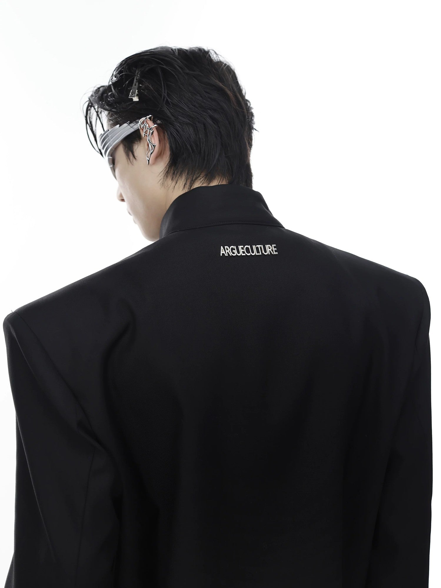 Close up shot of the unique silver metal airplane buckle hardware