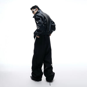 Back view showing the loose fit and deconstructed design of the jacket