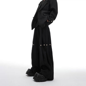 Black deconstructed wide-leg pleated trousers with baggy fit