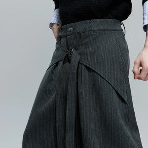 Side profile of loose fit deconstructed pants for men