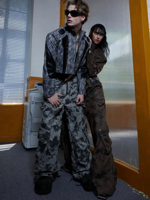 Close-up of spray ink and metal button details on cargo pants