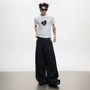 Close-up of 100% metallic beads on a distressed heart graphic