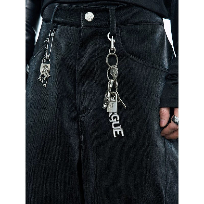 Close up of distressed silver metal logo charm and texture