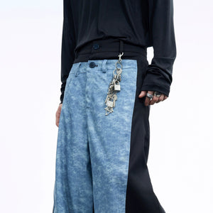 Metal buckle keychain clipped to streetwear denim pants belt loop