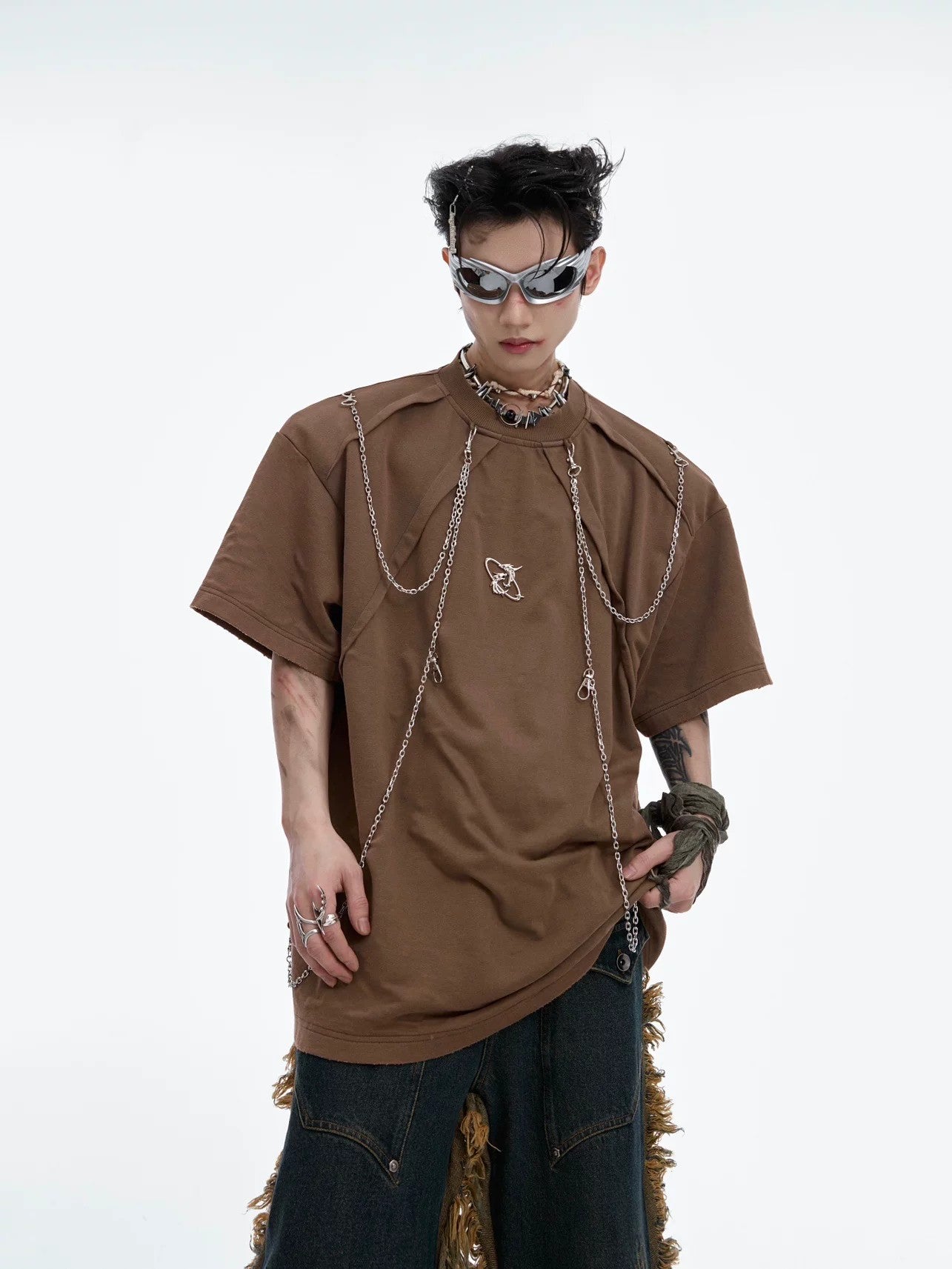 Front view of distressed black streetwear tee with metal chain