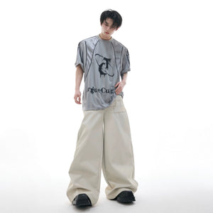 Model wearing loose fit distressed jersey tee in urban setting