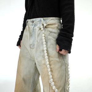 Full length view showing the loose flared leg fit of the pants