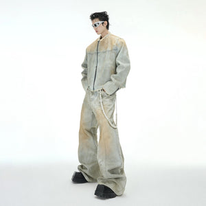 Model wearing distressed pearl jeans in an urban street setting