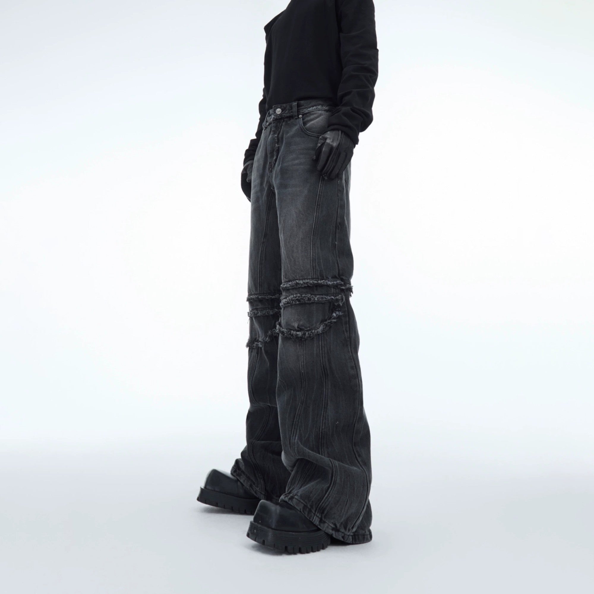 Front view of distressed water ripple washed straight leg jeans