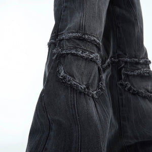 Model wearing blue water ripple jeans in a street setting