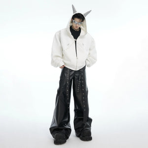 Couple wearing matching Doberman studded hoodies in street setting