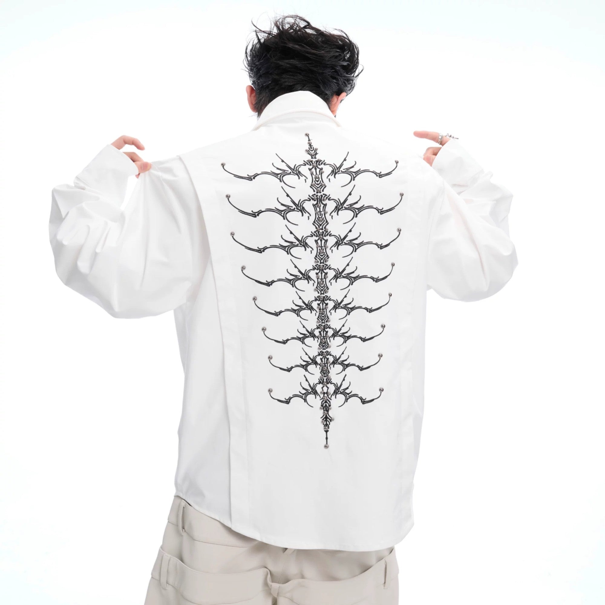 Front view of men's white deconstructed streetwear shirt with embroidery