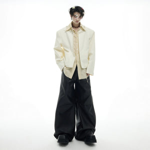 Detailed view of metal beads and hardware on shirt collar