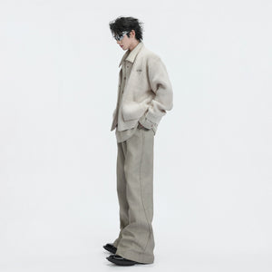 Close-up of khaki deconstructed layered knit sweater collar and fabric