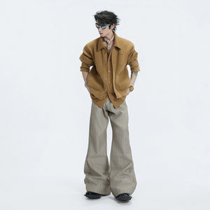 Lifestyle shot of a model wearing the deconstructed layered wool sweater