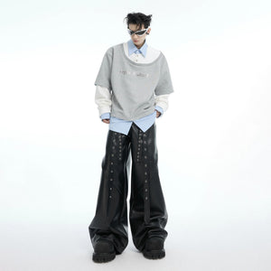 Detailed view of the faux layered sleeve construction and fabric texture.