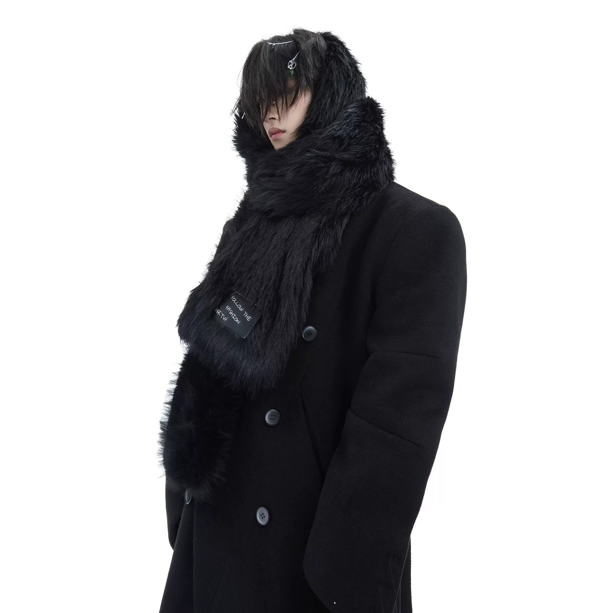 Close-up of the soft texture and raw edge of the black faux mink scarf