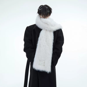 Oversized 220cm faux fur scarf draped over a black winter coat