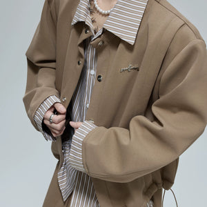Model wearing the khaki striped cardigan set in an urban setting