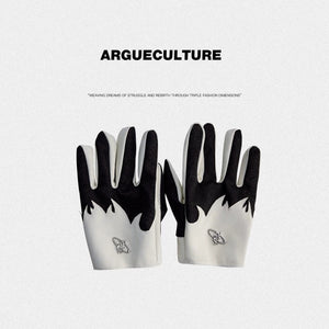 Close up of black sheepskin gloves with white flame design and croc texture