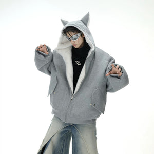 Gray reversible streetwear jacket showing the plush fur lining and 3D ears.